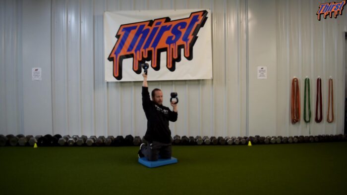 Tall Kneeling Alternating Bottoms Up KB Overhead Press