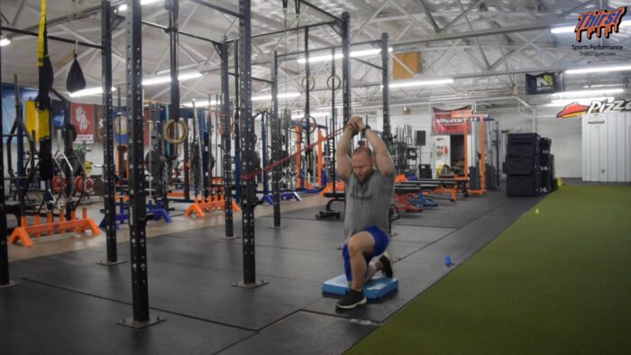 Half Kneeling Band Pallof Press To Overhead Raise