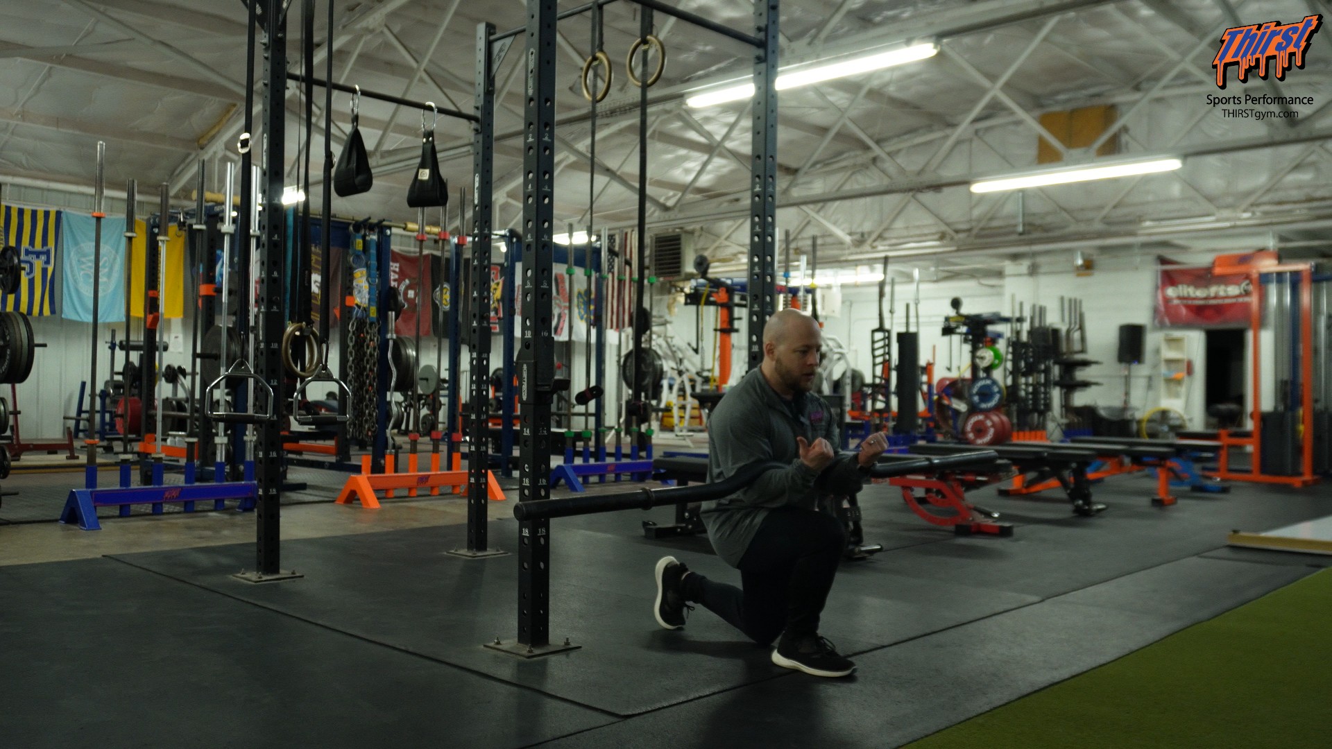 Barbell Zercher Reverse Lunge