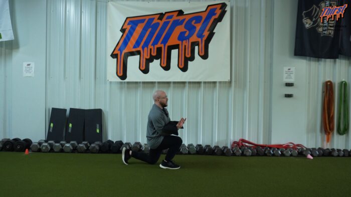 Sandbag Zercher Walking Lunge